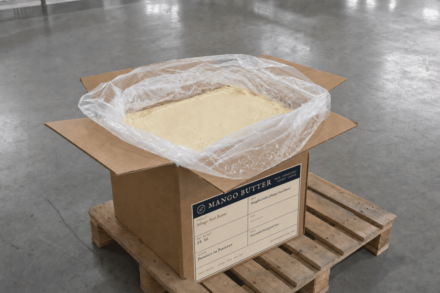 An opened 25 kg Mango Butter carton with its food-grade liner folded back to show solid, pale mango butter